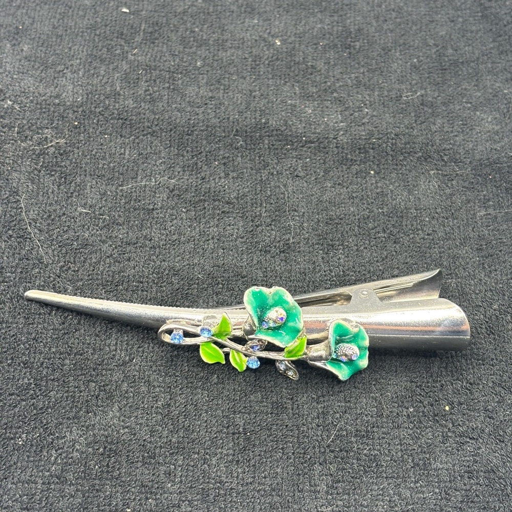Silver Hair Clip with Green enamel Floral Design with blue rhinestones. 5"